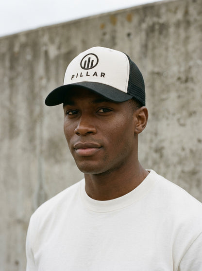Model wearing the off-white PILLAR Trucker