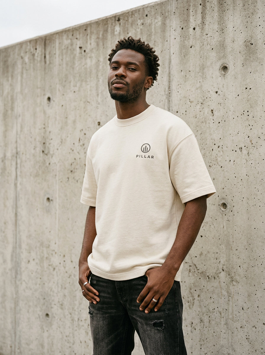 Model wearing the off-white PILLAR Forged Foundation Tee